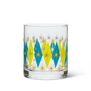 You don’t have to be a fan of classic art-deco style to be a fan of this retro-chic Diamond Tumbler. This sturdy tumbler glass features a delightful alternating pattern of green and blue diamonds accented with golden stars. Create the perfect Old Fashion for casual get-togethers, game nights and more. Pair two together with a bottle of your favourite whiskey for a great Birthday, Hostess, Father's Day, or Just Because Gift. Size: 3" H Capacity: 10oz Colour: Green/Blue Material: Glass